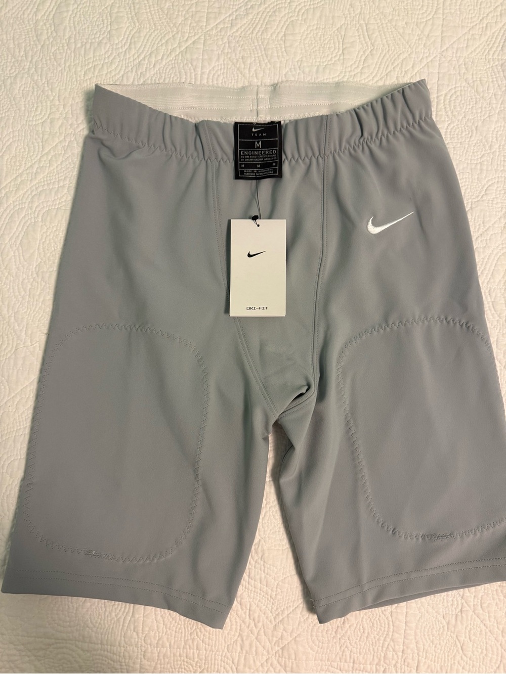 Nike Men’s Light Gray Athletic Football Shorts with White Swoosh